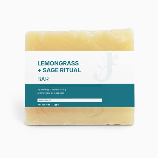 Bar of soap with 'Lemongrass + Sage Ritual' label on a white background