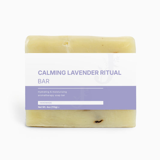Calming Lavender Ritual soap bar with a purple label on a white background